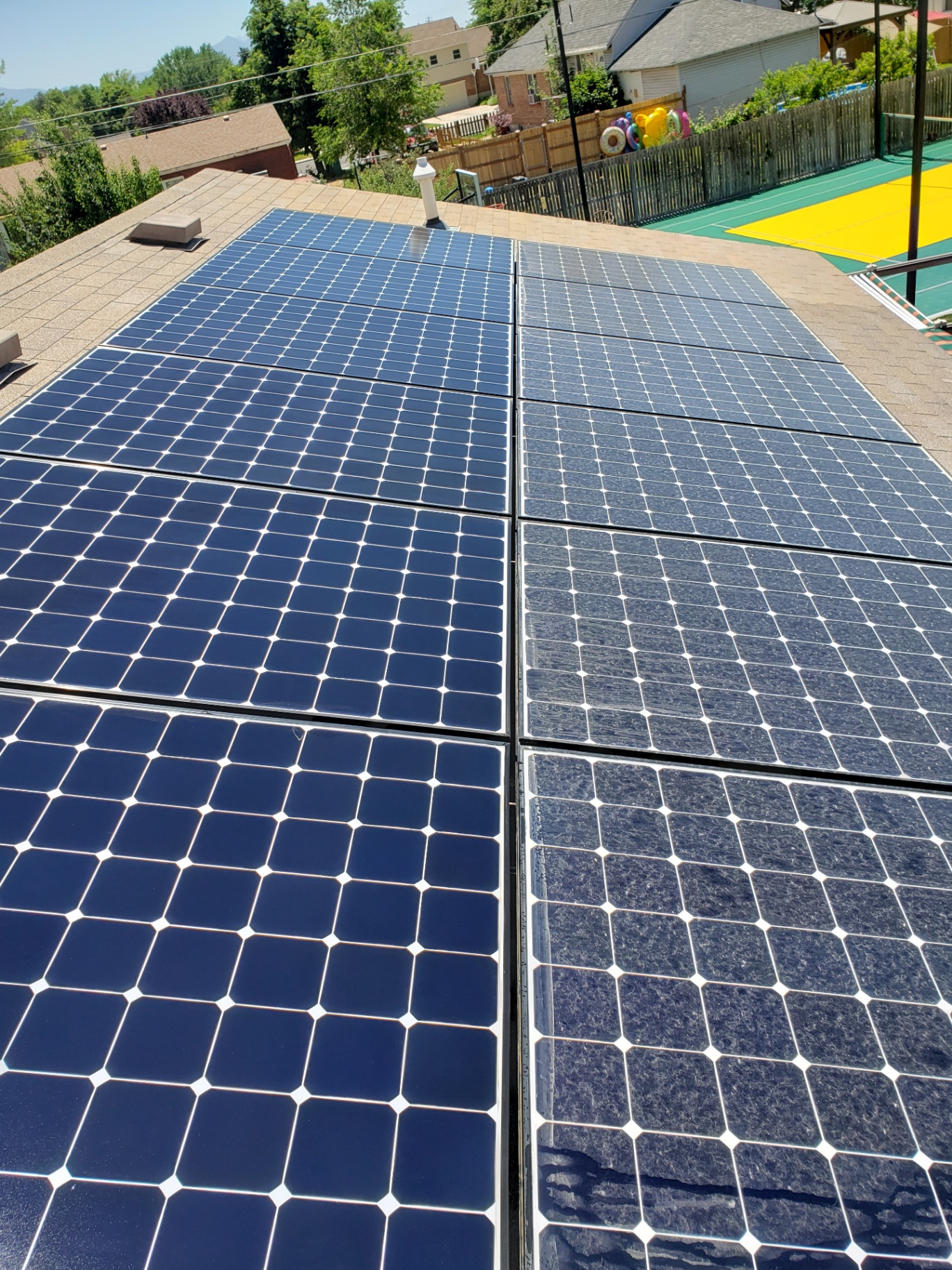 Clean solar panels on a home roof in Utah County, UT - serviced by Purity Cleaning Systems